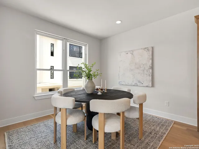 a dining room with furniture and window
