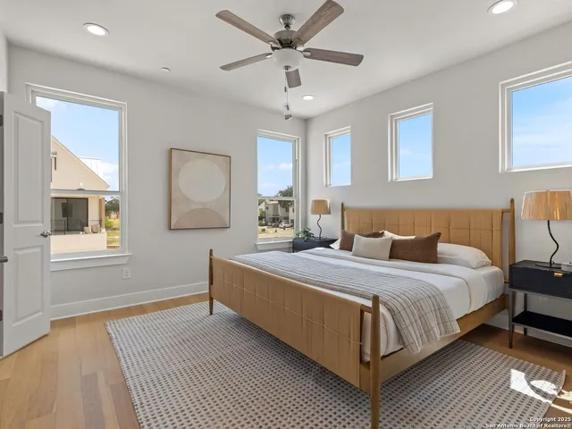 a bedroom with bed and window