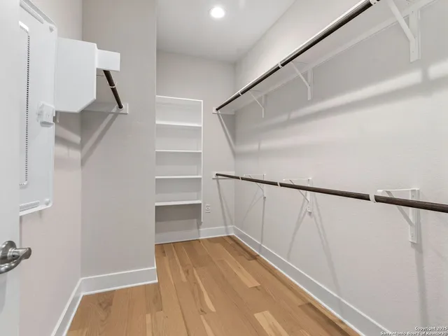 a view of an empty walk in closet