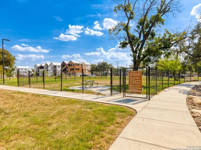 a view of a swimming pool with an outdoor space and seating