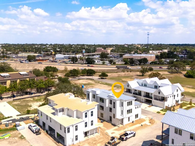 a view of a swimming pool with lawn chairs