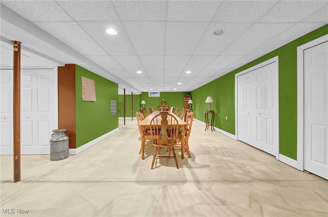 2690 Mayfair Road Akron, OH 44312 - Photo 28 of 31 Dining area featuring recessed lighting, a paneled ceiling, and concrete flooring