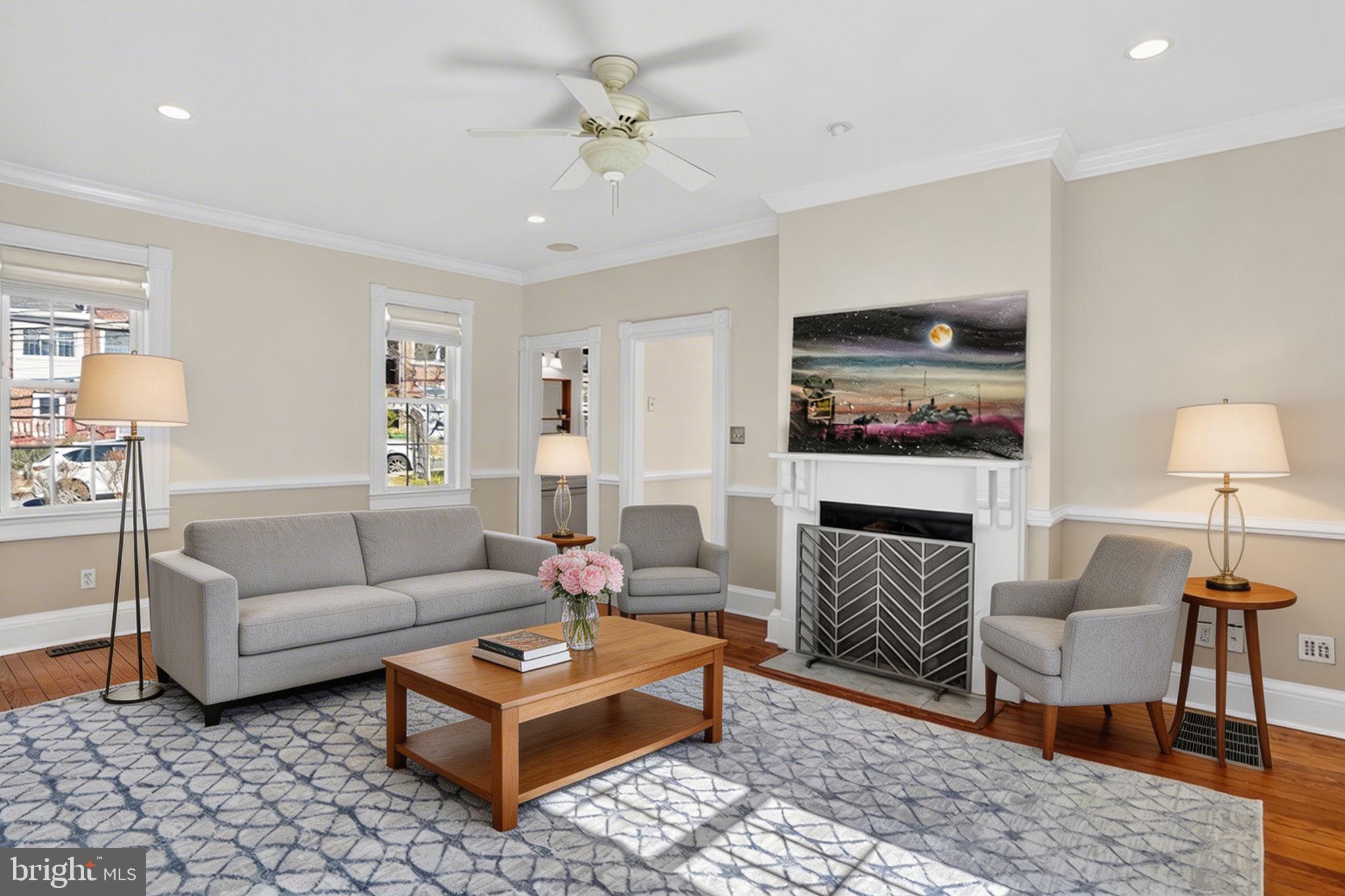 1007 Roland Heights Avenue Baltimore, MD 21211 - Photo 12 of 78 a living room with furniture a rug and a fireplace