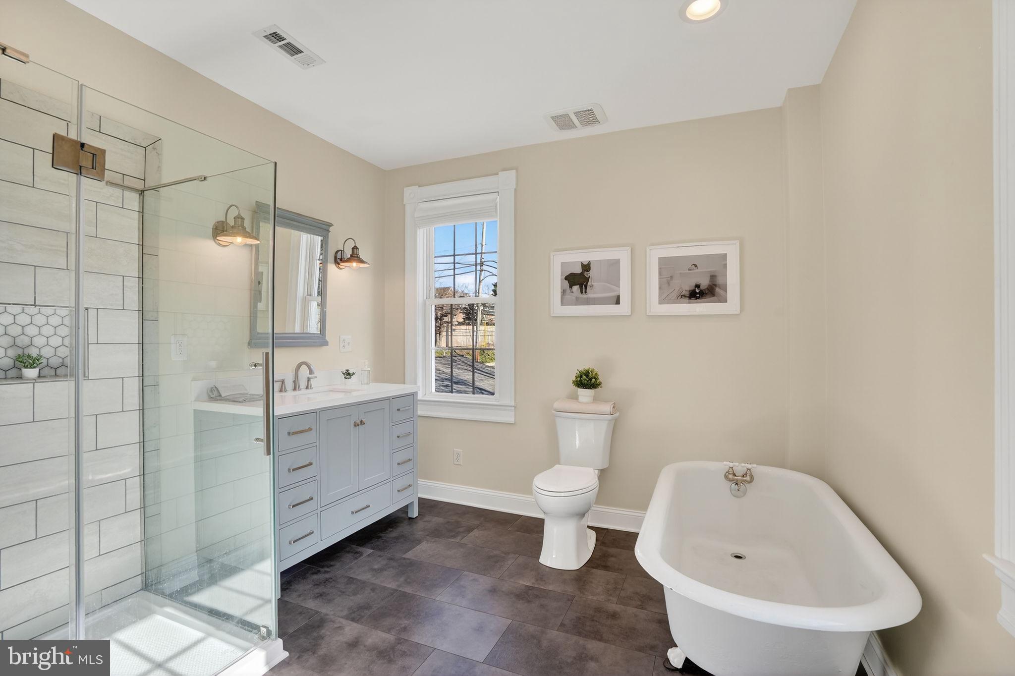 1007 Roland Heights Avenue Baltimore, MD 21211 - Photo 16 of 78 a bathroom with a sink toilet and shower