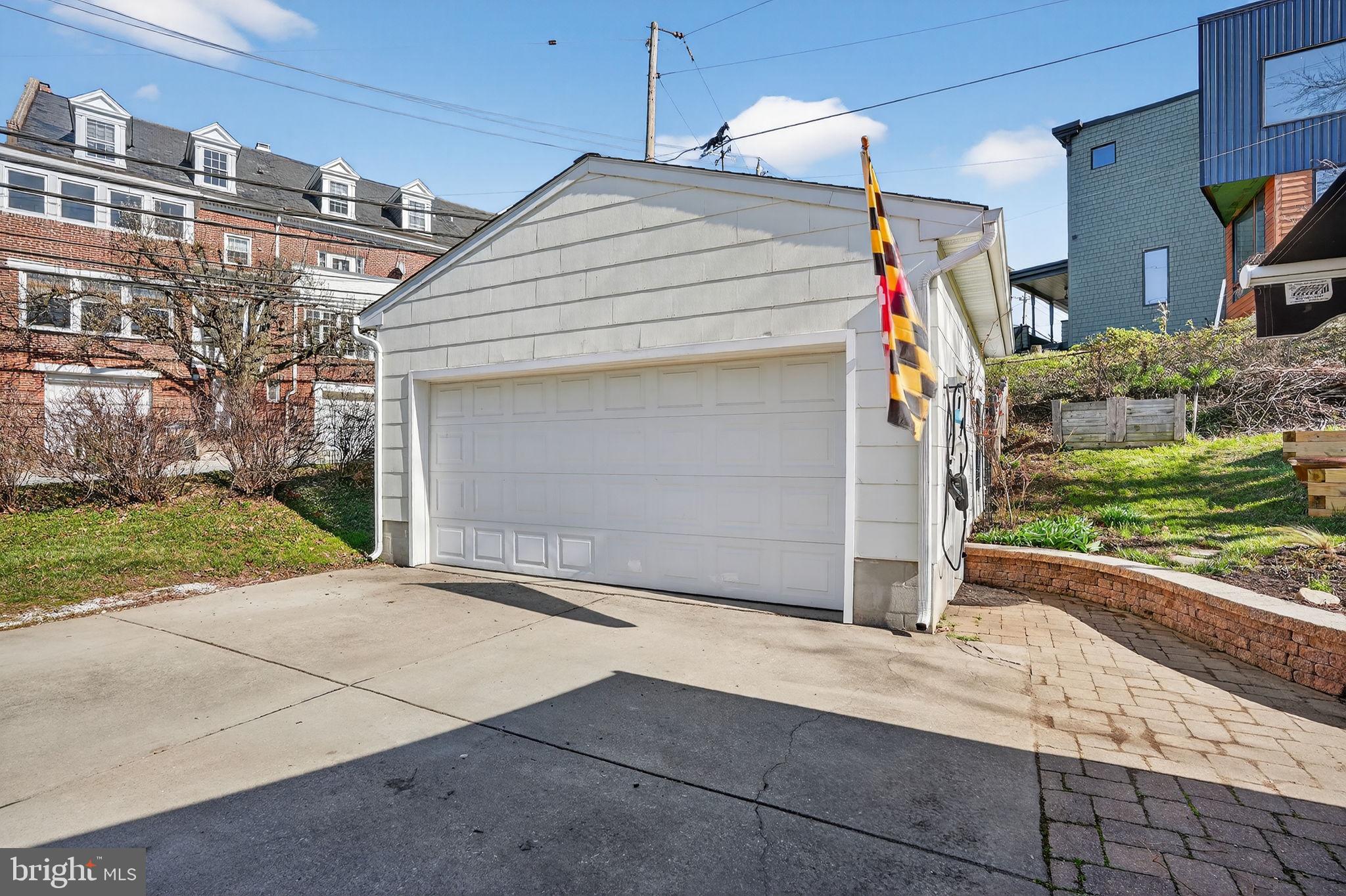 1007 Roland Heights Avenue Baltimore, MD 21211 - Photo 28 of 78 a front view of a house with a garage