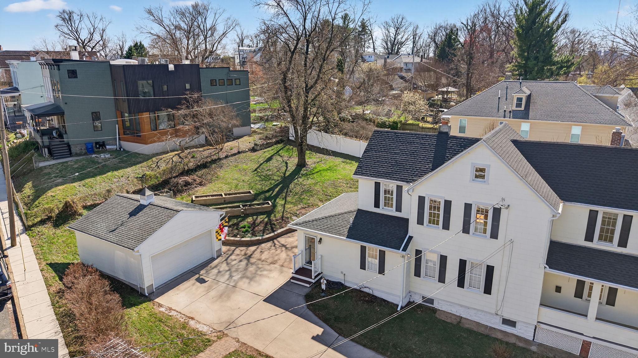 1007 Roland Heights Avenue Baltimore, MD 21211 - Photo 29 of 78 an aerial view of a house with backyard porch and sitting area