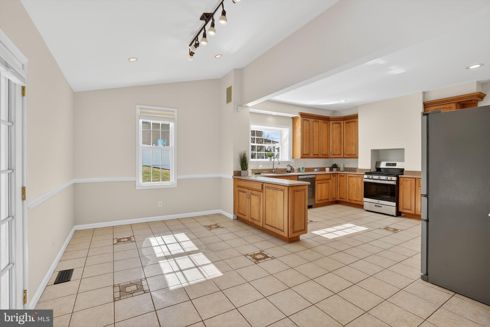 1007 Roland Heights Avenue Baltimore, MD 21211 - Photo 35 of 78 a large kitchen with a window and a counter top space