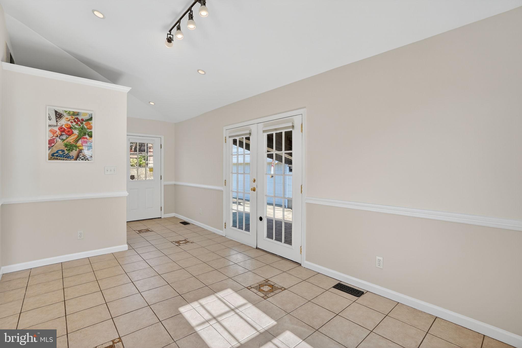 1007 Roland Heights Avenue Baltimore, MD 21211 - Photo 4 of 78 a view of empty room with wooden floor