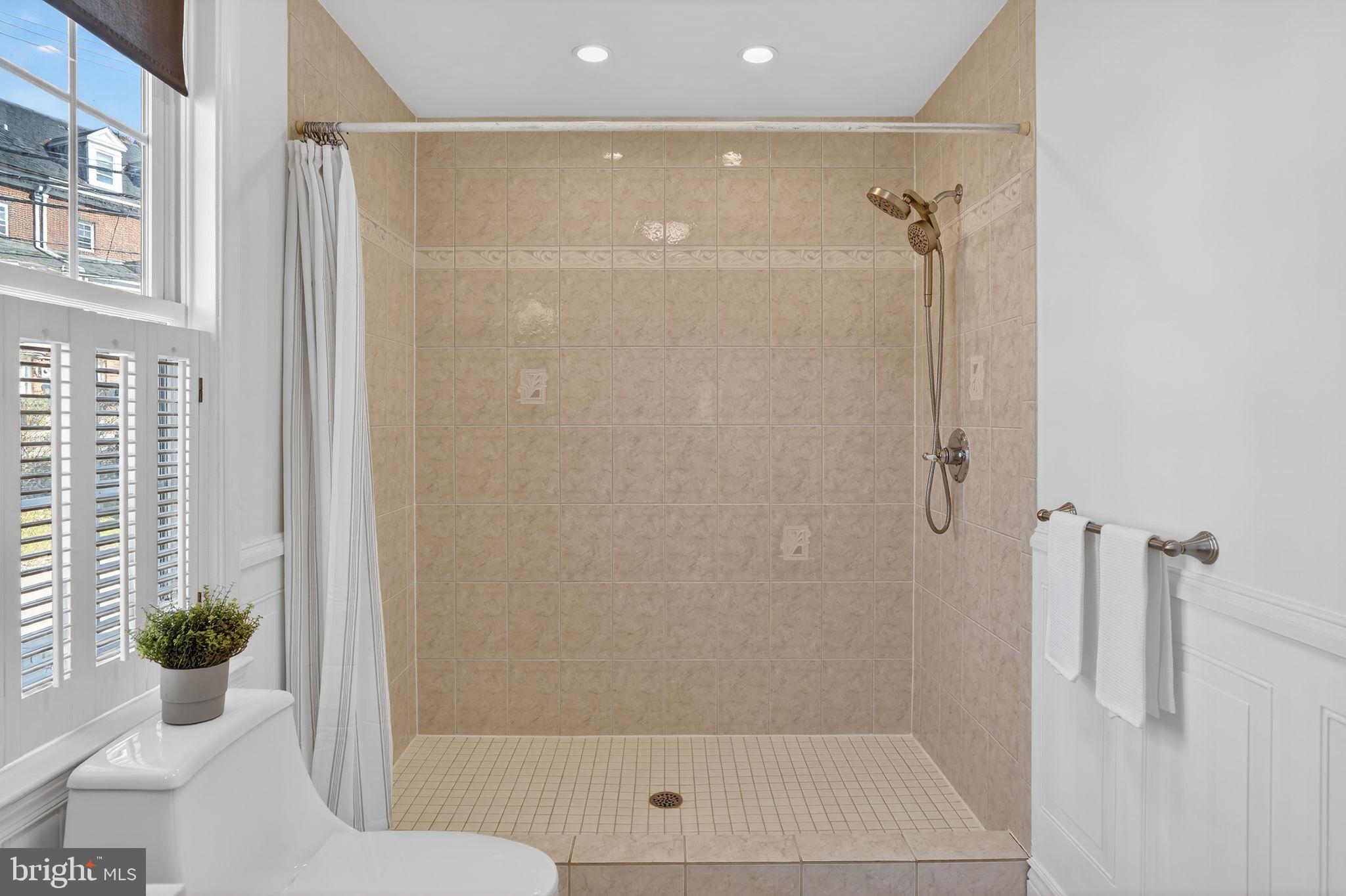 1007 Roland Heights Avenue Baltimore, MD 21211 - Photo 45 of 78 a bathroom with a shower