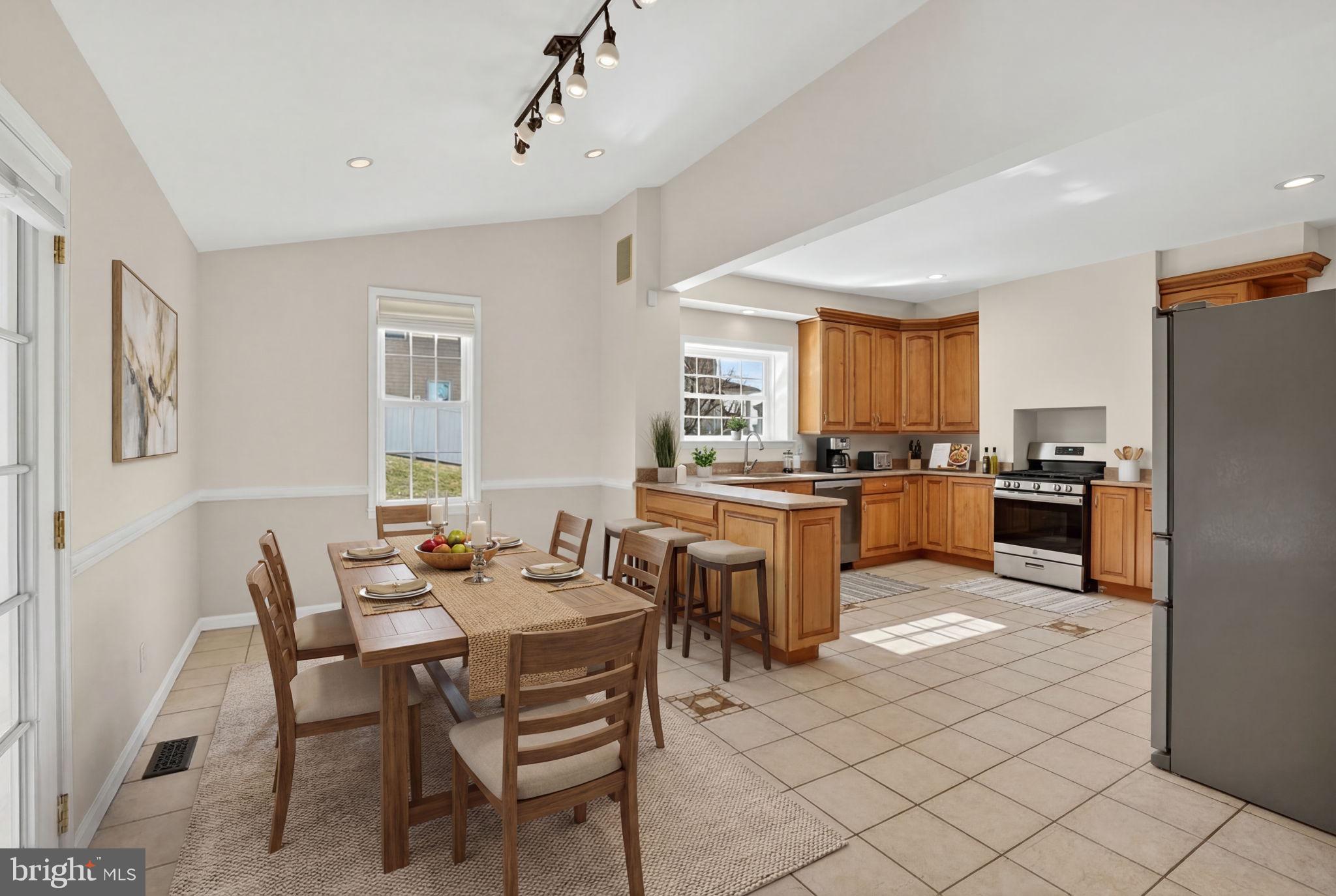 1007 Roland Heights Avenue Baltimore, MD 21211 - Photo 5 of 78 a large kitchen with a table and chairs