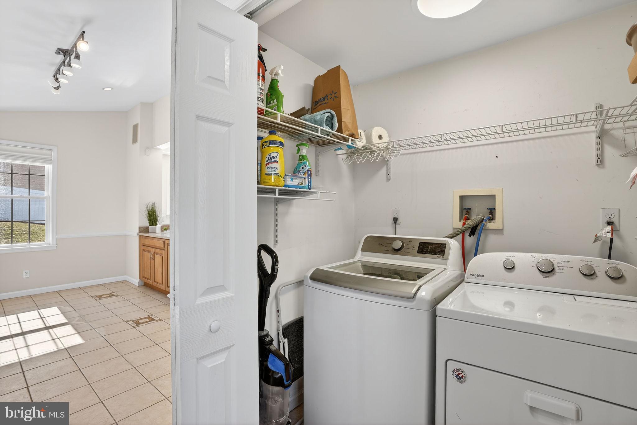 1007 Roland Heights Avenue Baltimore, MD 21211 - Photo 58 of 78 a view of storage and utility room with washer and dryer