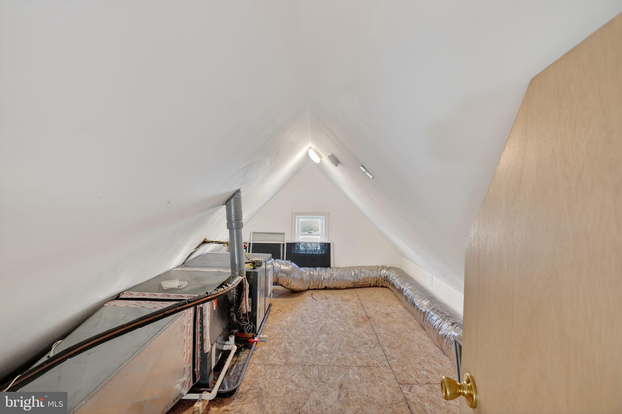 1007 Roland Heights Avenue Baltimore, MD 21211 - Photo 59 of 78 a view of a livingroom with wooden floor and stairs