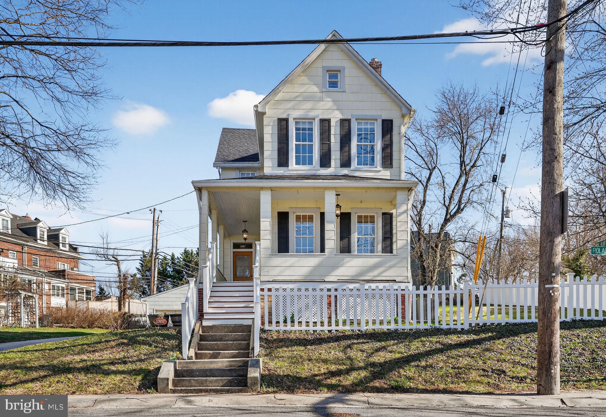 1007 Roland Heights Avenue Baltimore, MD 21211 - Photo 63 of 78 a front view of a house with a yard