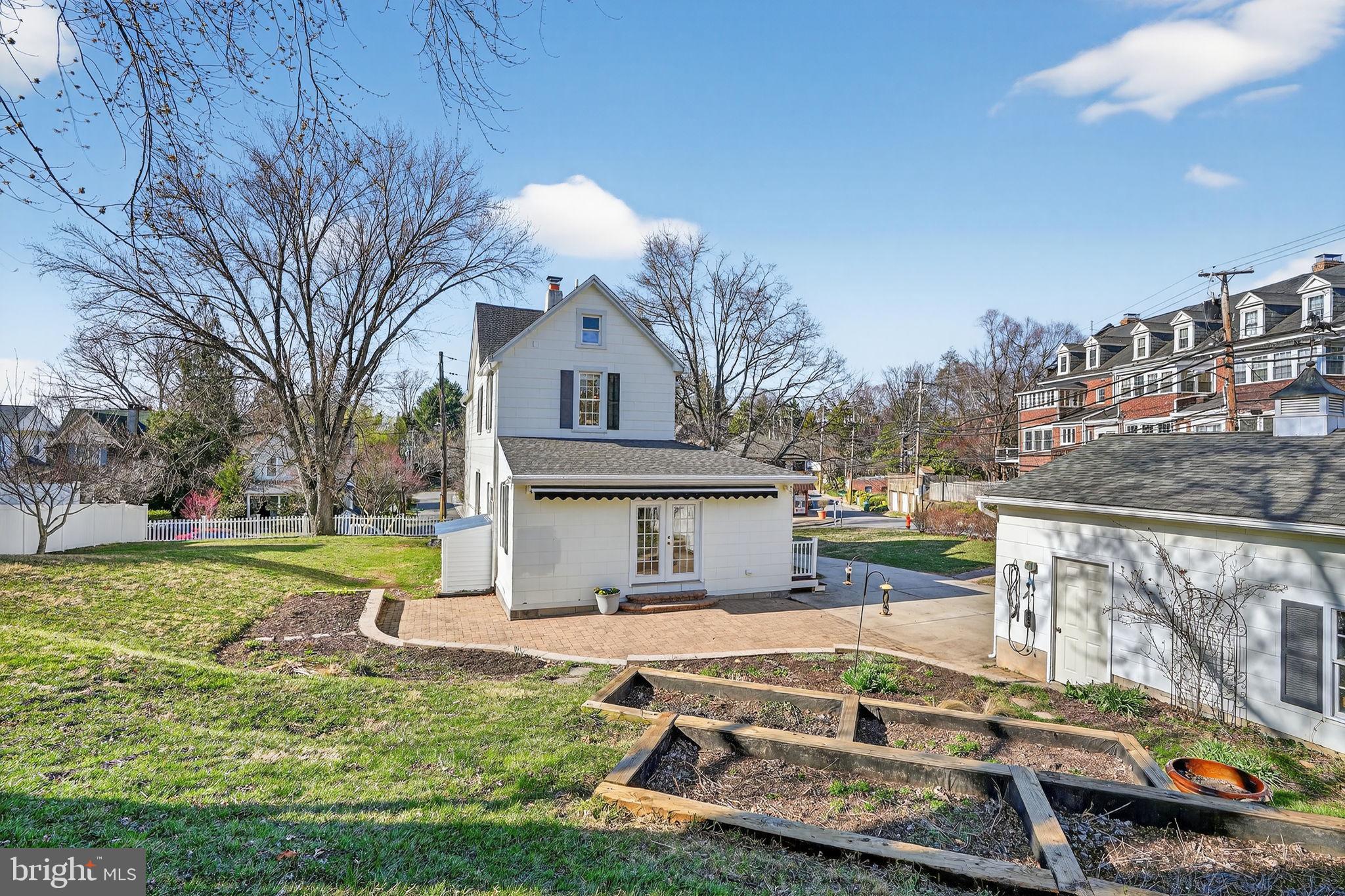 1007 Roland Heights Avenue Baltimore, MD 21211 - Photo 65 of 78 a view of a house with pool and a yard