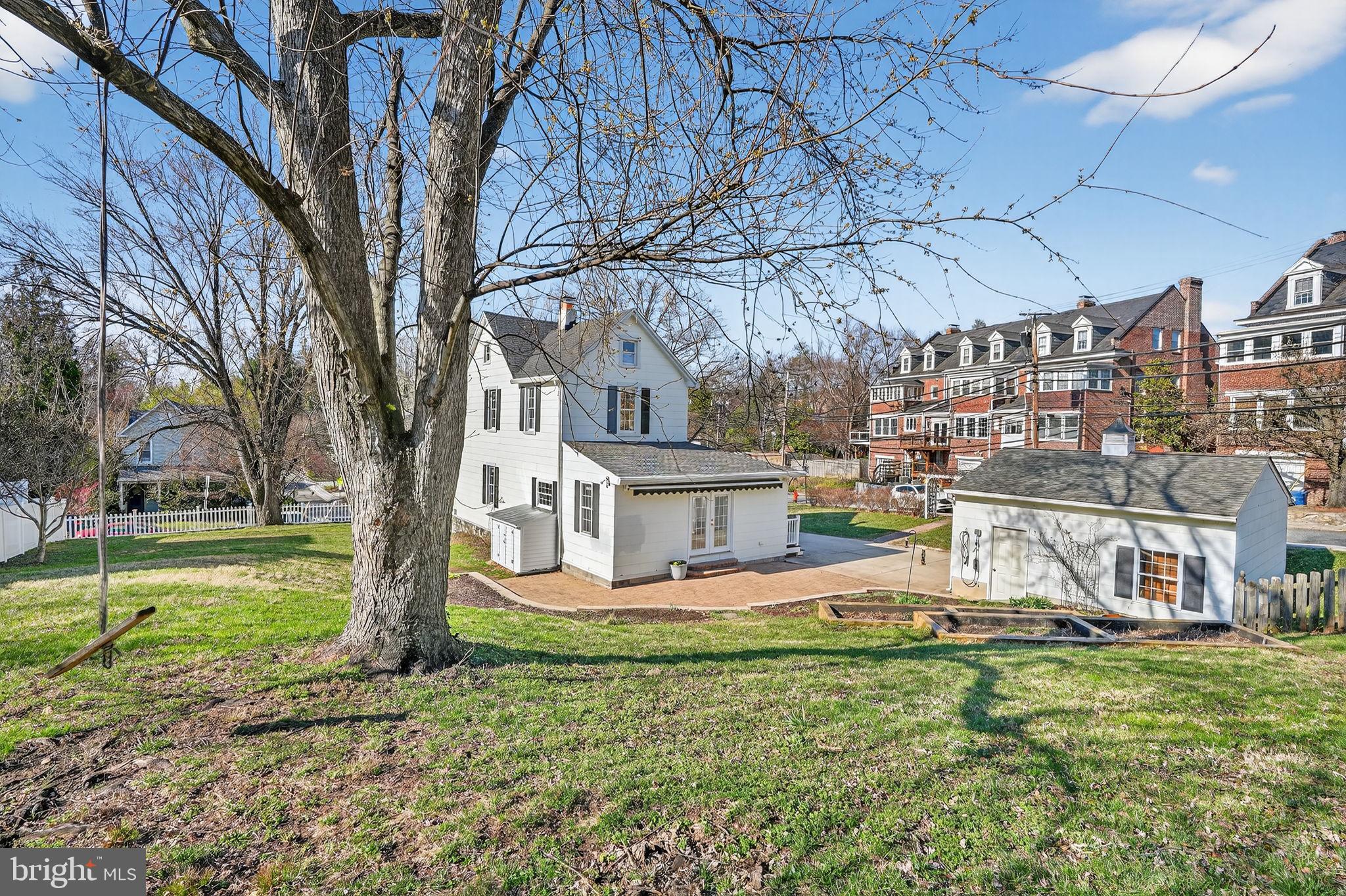 1007 Roland Heights Avenue Baltimore, MD 21211 - Photo 67 of 78 a view of a house with a yard