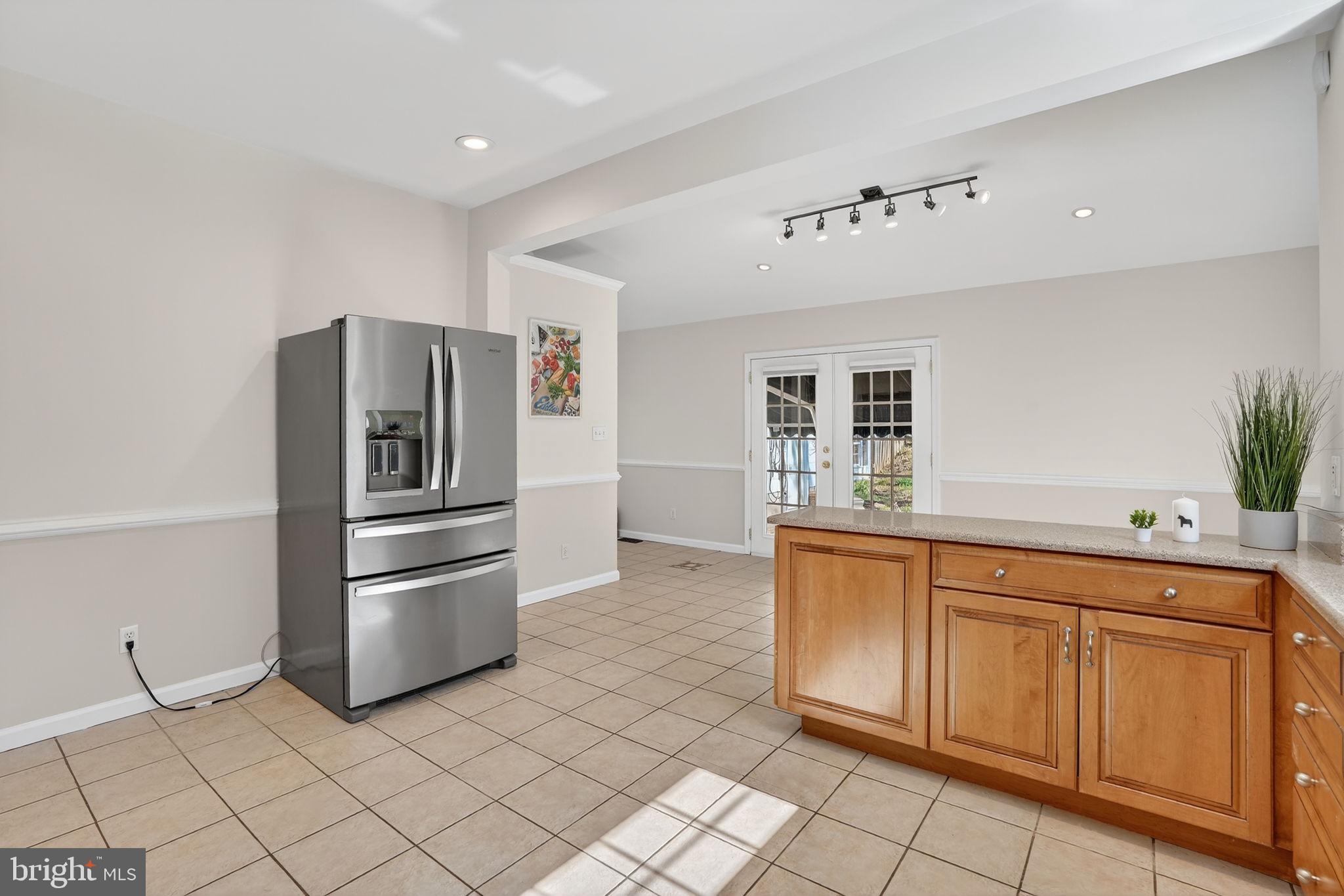 1007 Roland Heights Avenue Baltimore, MD 21211 - Photo 9 of 78 a kitchen with granite countertop cabinets and stainless steel appliances