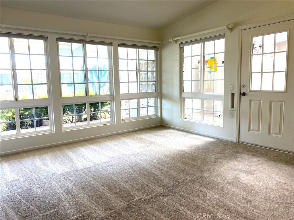 1681 Monterey Road Seal Beach, CA 90740 - Photo 13 of 23 a view of an empty room with a window