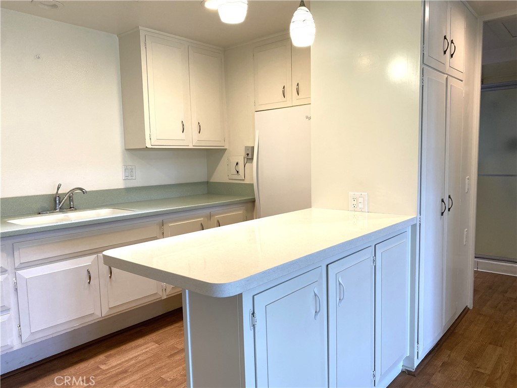 1681 Monterey Road Seal Beach, CA 90740 - Photo 8 of 23 a kitchen with a sink and cabinets