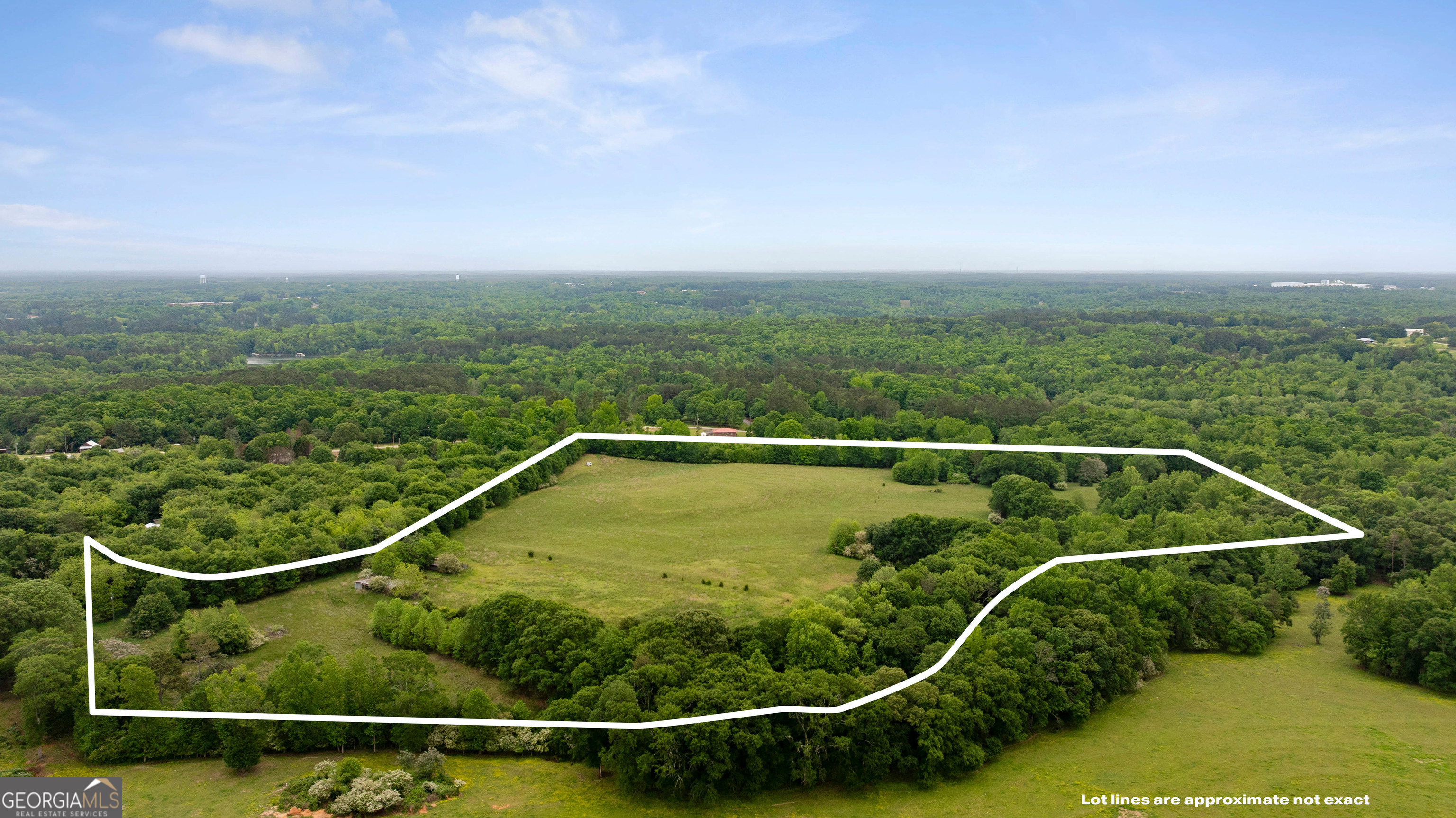 a view of a balcony with yard