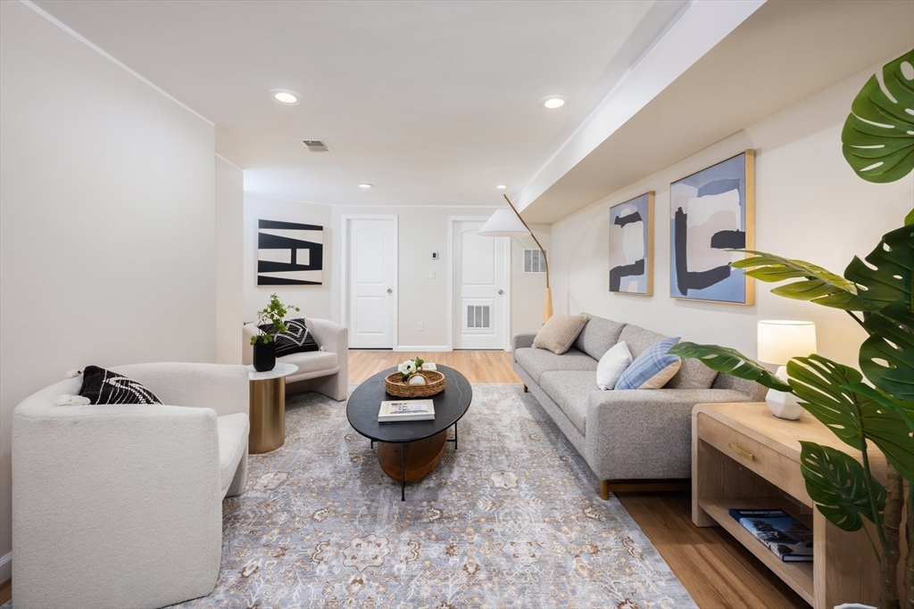 45 Bates Road, Unit 45 Watertown, MA 02472 - Photo 11 of 19 a living room with furniture and a potted plant