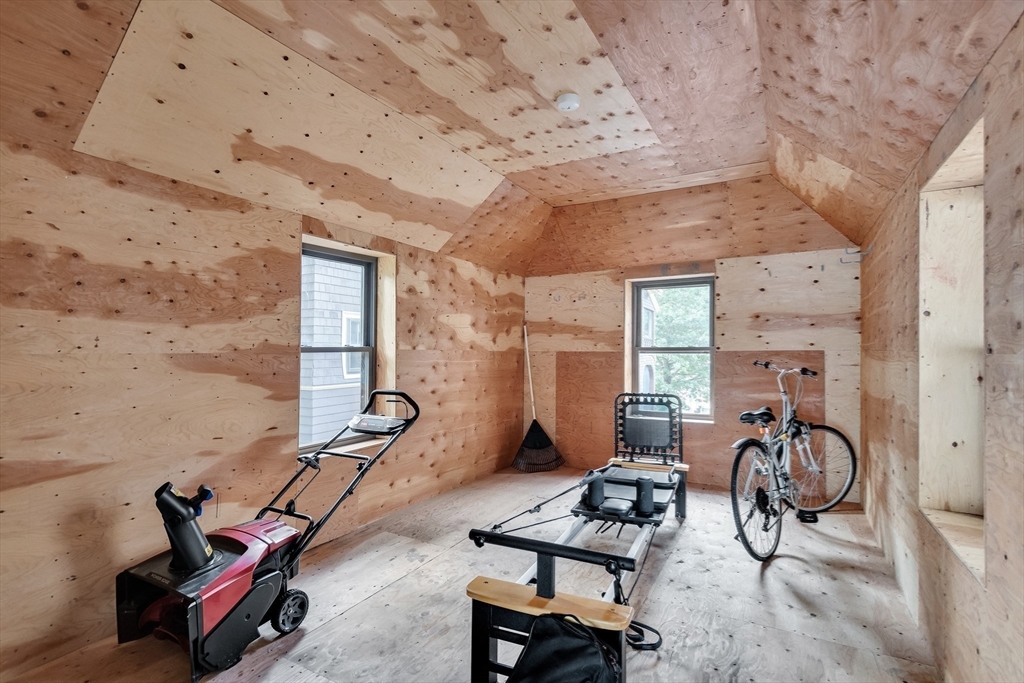 45 Bates Road, Unit 45 Watertown, MA 02472 - Photo 15 of 19 a room with gym equipment and windows
