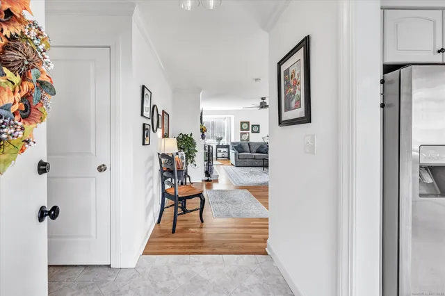 a view of a livingroom with wooden floor and a cabinet