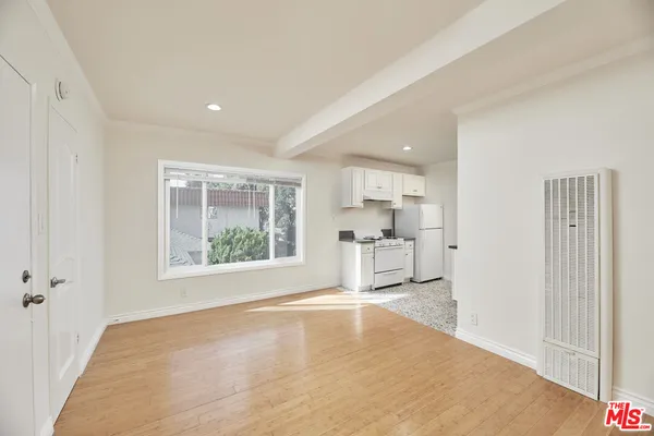 a view of a kitchen with a sink and a window