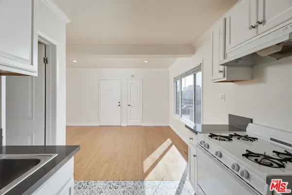 a kitchen with a stove and a sink