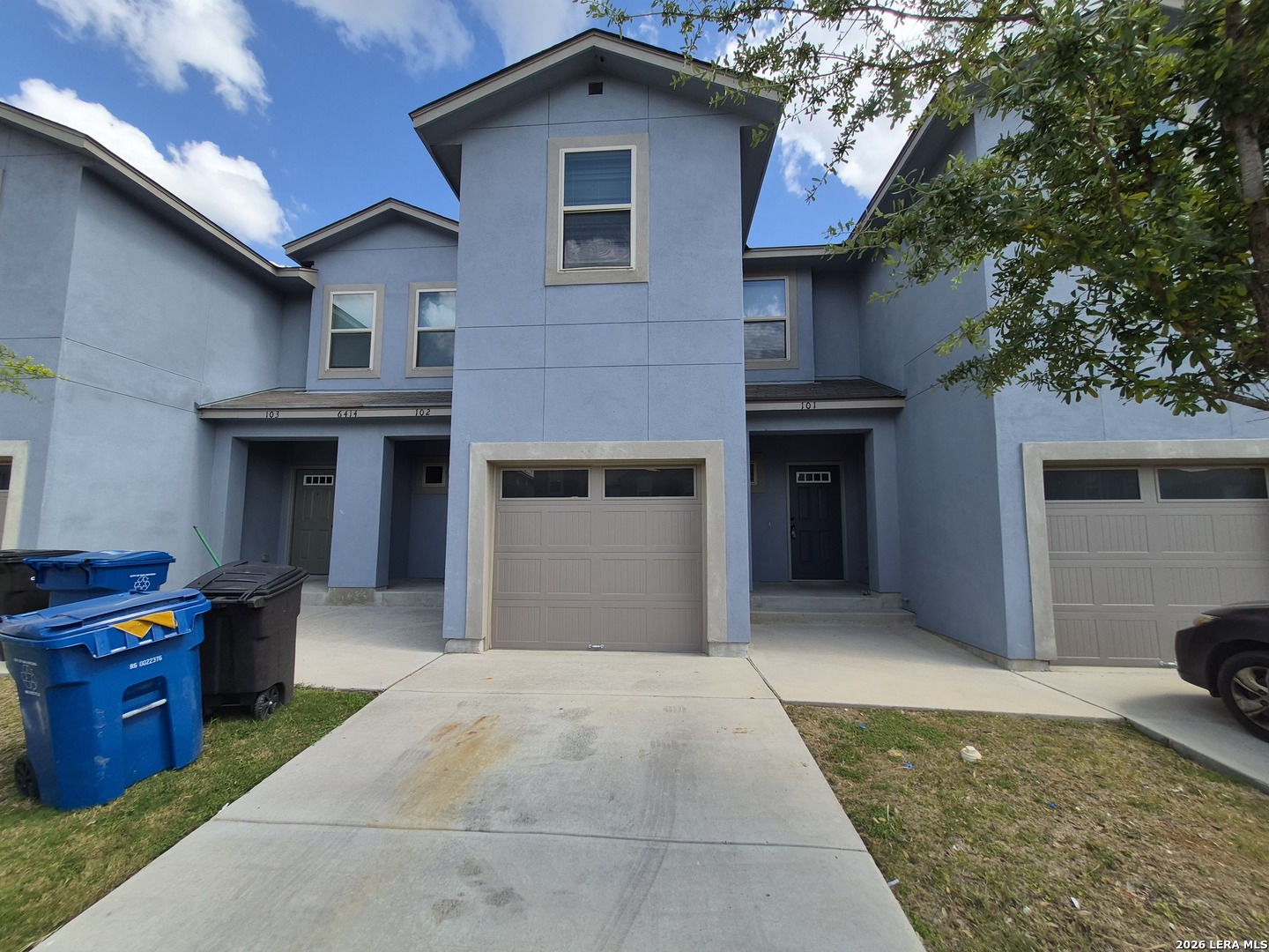 6414 Luglio Lane, Unit 101 San Antonio, TX 78233 - Photo 1 of 23 a front view of a house with barbeque area