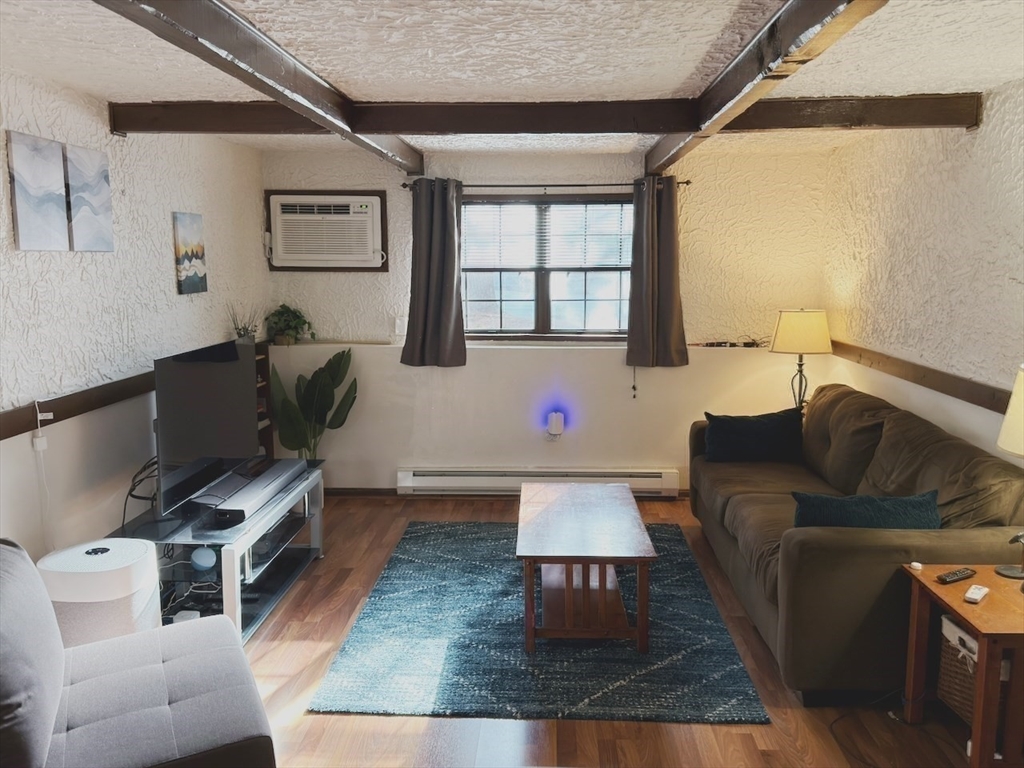 42 Swanson Court, Unit 14A Boxborough, MA 01719 - Photo 5 of 11 a living room with furniture and a window