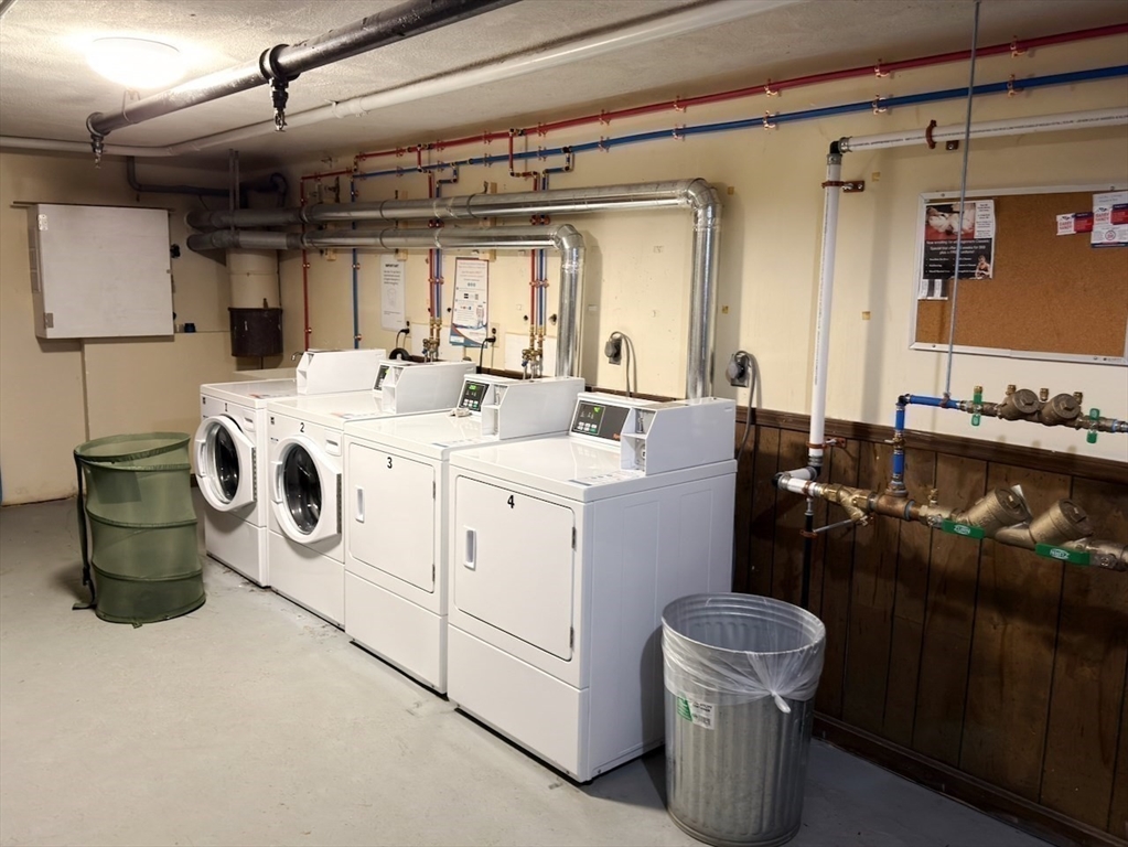 42 Swanson Court, Unit 14A Boxborough, MA 01719 - Photo 9 of 11 a utility room with dryer and washer