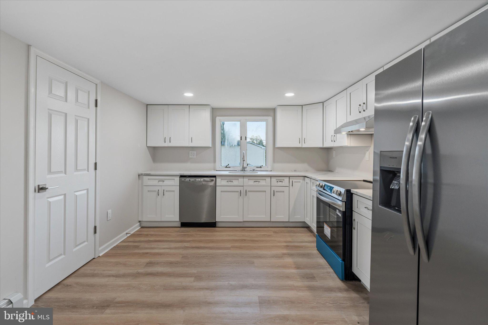 831 Deturksville Road Pine Grove, PA 17963 - Photo 3 of 24 a kitchen with a refrigerator sink and cabinets