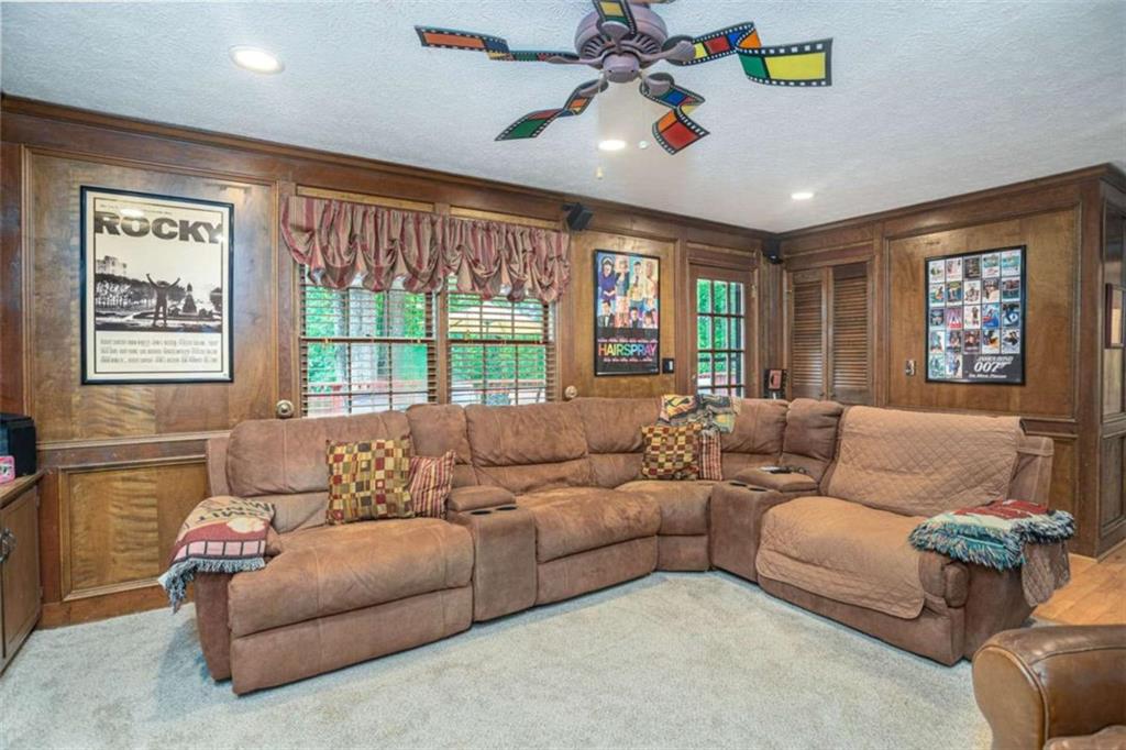 3838 Hunting Ridge Drive Southwest Lilburn, GA 30047 - Photo 14 of 56 a living room with furniture and a large window