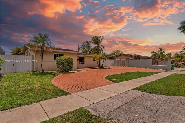 a view of a backyard with a garden and plants