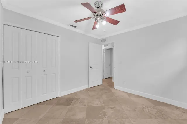 an aerial view of residential houses with outdoor space and parking