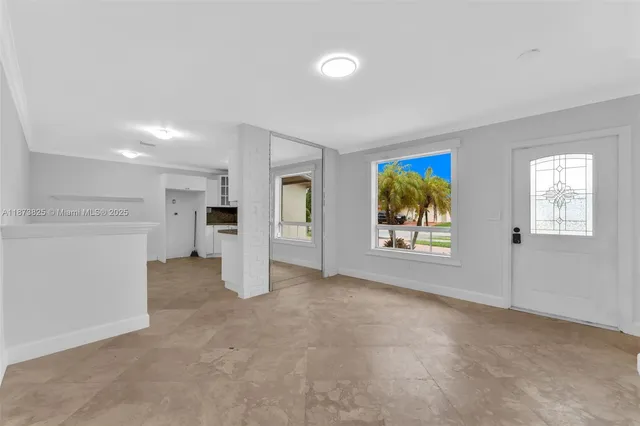 a view of an empty room with a window