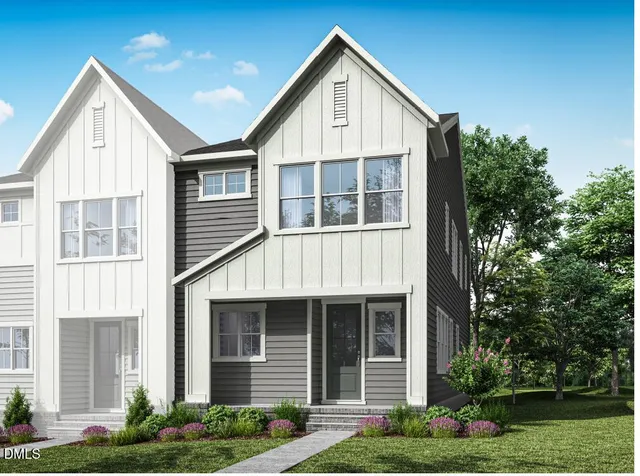 a view of a house with yard and plants