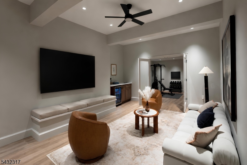 266 Brooklake Road Florham Park, NJ 07932 - Photo 40 of 50 a living room with furniture and a flat screen tv
