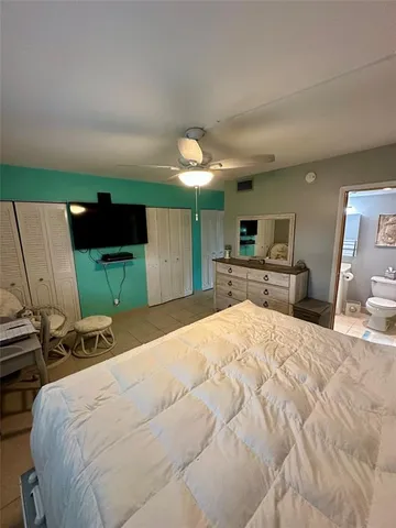 a bathroom with a toilet and a mirror