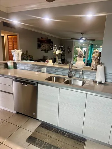 a kitchen with a sink and cabinets