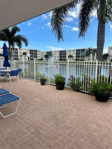 a kitchen with a stove a sink and a microwave