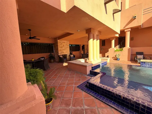 a outdoor space with the couches and dining table