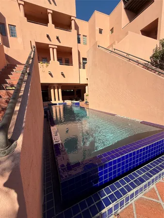 a balcony with view of nearby houses