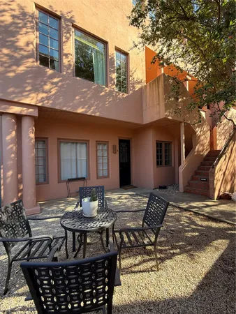 a view of a dinning table and chairs in the patio