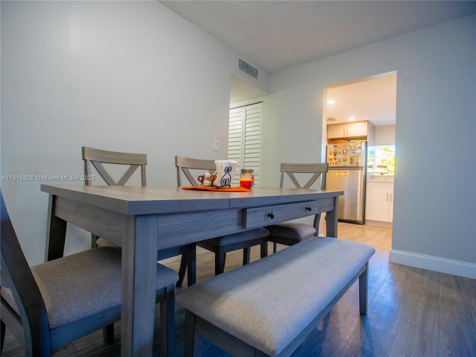 9400 West Flagler Street, Unit 313 Miami, FL 33174 - Photo 11 of 35 a view of a dining room with furniture and window