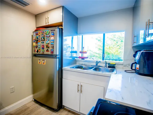 a kitchen with stainless steel appliances a stove and a refrigerator