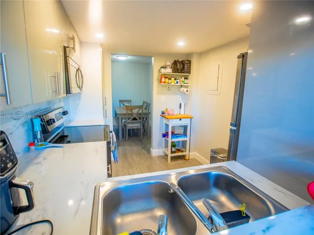 a view of a living room and dining room