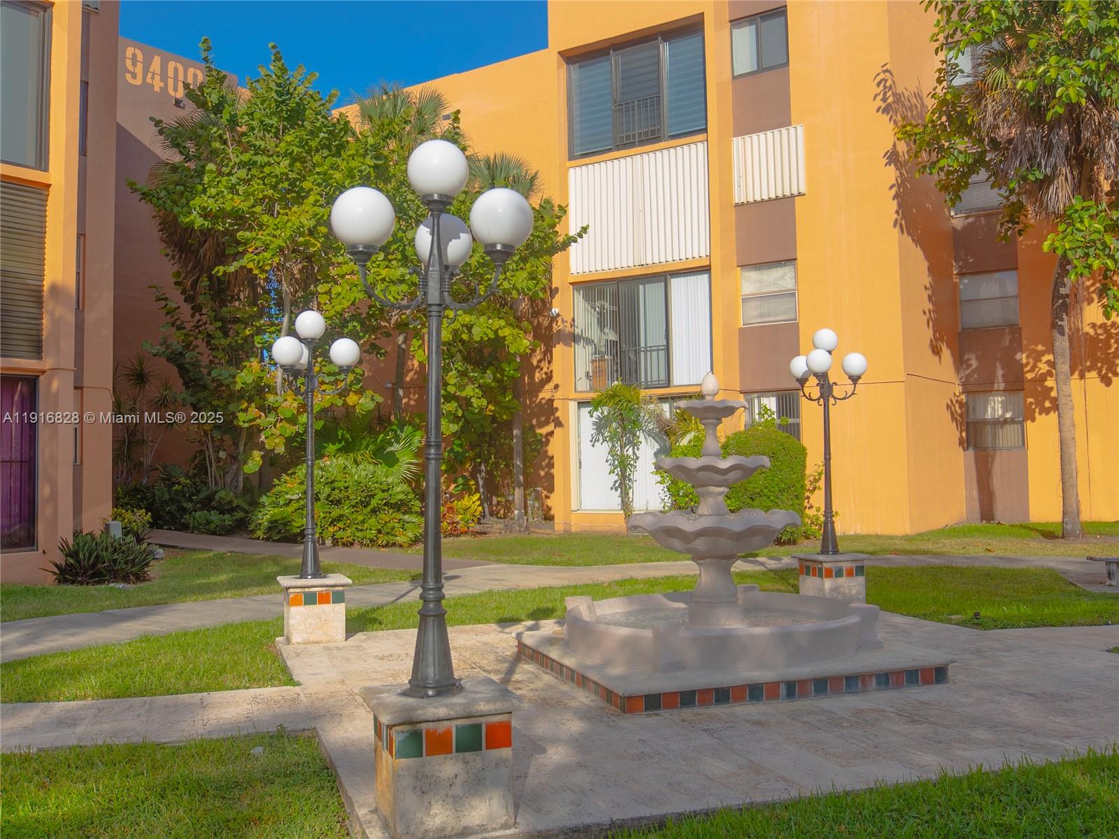 9400 West Flagler Street, Unit 313 Miami, FL 33174 - Photo 2 of 35 a view of a building with a garden
