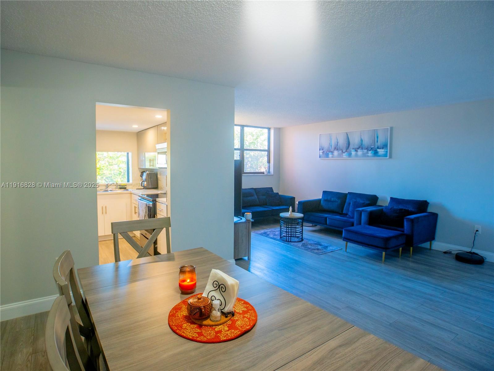 9400 West Flagler Street, Unit 313 Miami, FL 33174 - Photo 10 of 35 a living room with furniture and a wooden floor