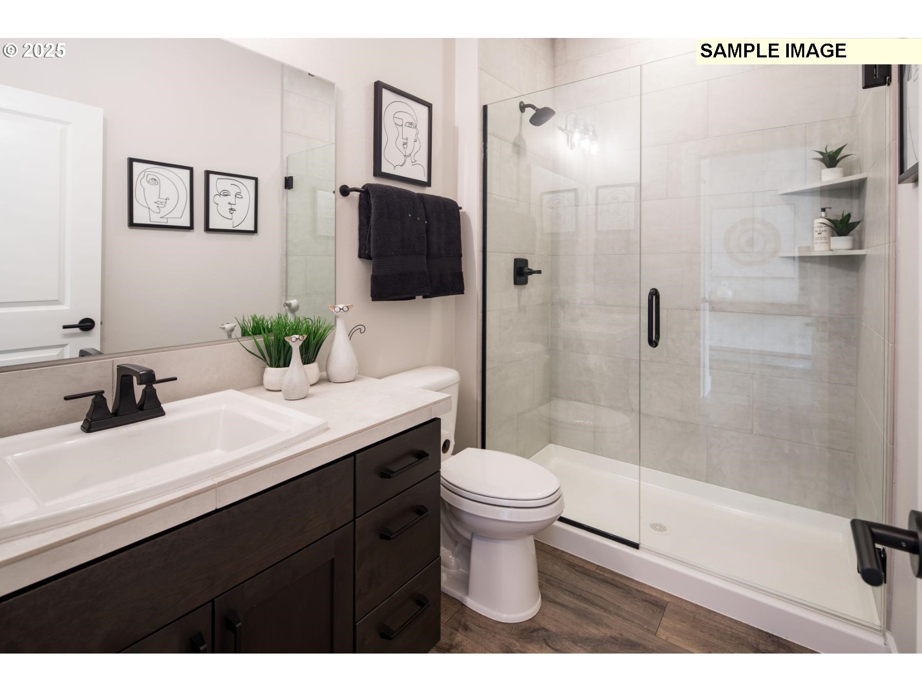 8119 North Hargrave Street Camas, WA 98607 - Photo 12 of 23 a bathroom with a sink toilet a mirror and shower